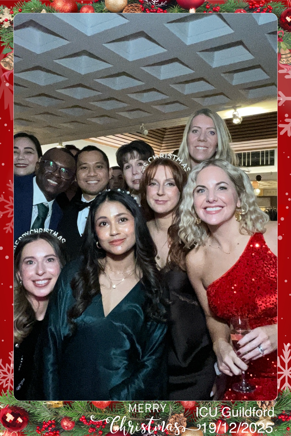 ICU Guilford Christmas Party 2025 guests enjoying the Digital Selfie Pod with DJ V (Saxophonist & DJ)